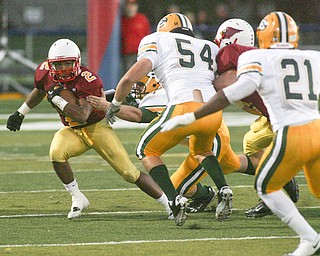 ROBERT K. YOSAY | THE VINDICATOR..#2 Charlie Brown Tries to Elude #54 Don Pavlov and #21 Phil Smith during second quarter action as Cardinal Mooney vs St. Ed's at Fitch Stadium..-30