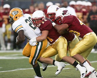 ROBERT K. YOSAY | THE VINDICATOR..A Host of Cardinals #40 Nick Hargate #24 Joe DeNiro and #11 Anthony Patella stop #20 Terrel Bates after short yards during the first half as Cardinal Mooney vs St. Ed's at Fitch Stadium..-30