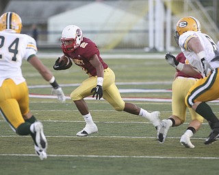 ROBERT K. YOSAY | THE VINDICATOR..CM #2 Charlie Brown tries to elude St eds #24 Rob Coury and #6 Frank Finotti during first quarter action at Cardinal Mooney vs St. Ed's at Fitch Stadium..-30