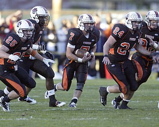 William D Lewis|The Vindicator Howland's Zac Wilson carries the ball during 1 rst qtr action Friday at Howland.