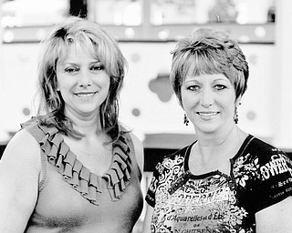 Working to assure the success of the annual Market on the Green are, from left, Rhonda Rance and Danielle Strock, who are serving as chairwomen for the Sept. 18 event. Funds from the event will provide scholarships for Canfield High School graduates. Proceeds from last year’s market provided scholarships for, below from left, Breann Machingo, Rebecca Brown and Kendal Malsch.