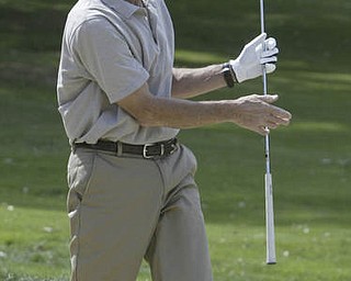 William D. Lewis| The VindicatorPaul Rezabek reacts after hitting out of a bunker at Greatest Golf Tourney Saturday.