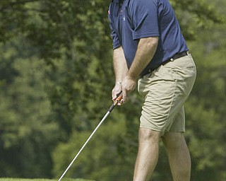 William D. Lewis| The Vindicator Chris Economus watches a putt at Greatest Golf Tourney Saturday.