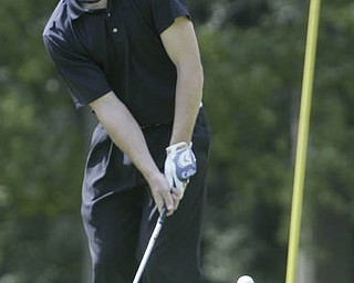 William D. Lewis| The Vindicator Kyle Firm chips on #10 at Greatest Golf Tourney Saturday.