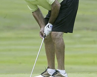 William D. Lewis| The Vindicator Tom Oneseti watches a putt lip the cup on #18 at Greatest Golf Tourney Saturday.