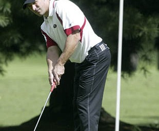 William D Lewis | The Vindicator Mike Porter sudies a put at TCC Sunday.