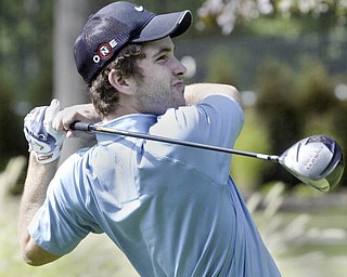William D Lewis | The Vindicator Kyle Firm watches his drive at TCC Sunday.