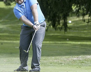 William D Lewis | The Vindicator Josh Foster chips at TCC Sunday.