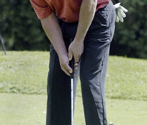 William D Lewis | The Vindicator Paul rovnak sinks a putt at TCC Sunday.