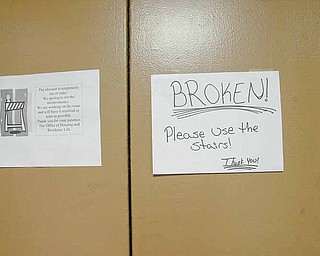 A sign on the elevator door at Kilcawley House dormitory at YSU cautions residents to take the stairs.