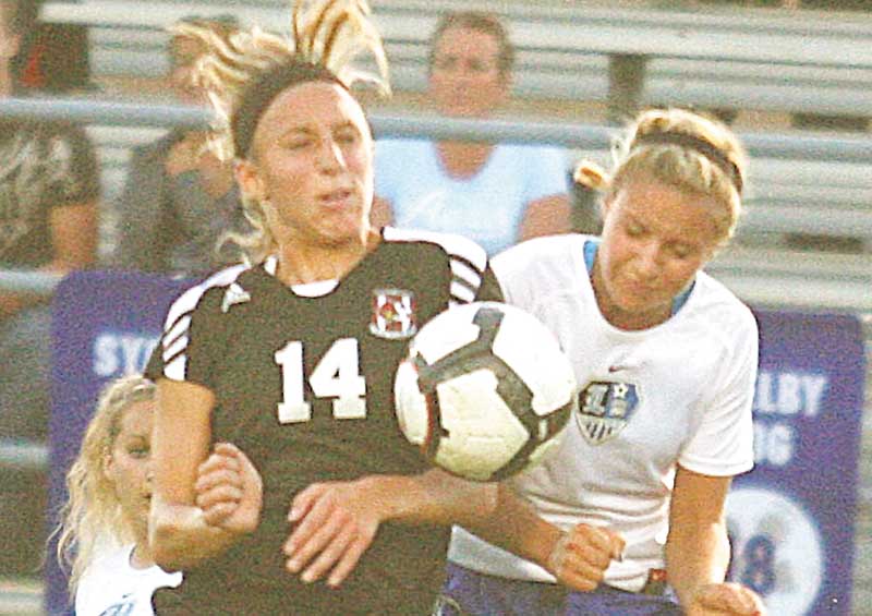 (14) Meredith Gleichert of Canfield and Lindsey Clark of Lakeview fight for the ball Monday night in Lakeview.