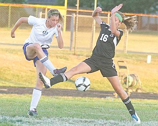 (6) Ali Gagne of Lakeview and (16) Kaylee Buchenic fight for the ball Monday night in Lakeview.