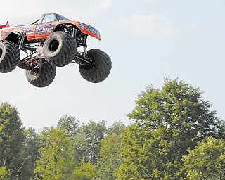 Joe Sylvester III of Boardman soars in his monster truck, Bad Habit, during his world-record-breaking jump Sept. 5.