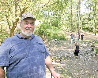Bill Burris, whose Creed Street home abuts the Fifth Street Park in Struthers, remembers years ago when the park used to be filled with activity. The city recently cleaned up the park, which had grown over and wasn’t being used.