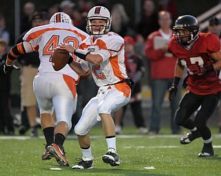 Howland QB Tim Parana passes from the pocket against Canfield during their game on Friday night.. Photo/Mark Stahl