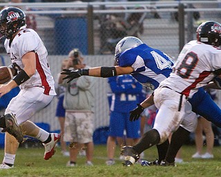Geoffrey Hauschild|The VIndicator.Salem's Trent Toothman (12) and Hubbard's ??? (44) during the second quarter of a match up between Salem and Hubbard at Hubbard Stadium on Friday evening.
