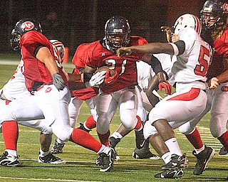 FITCH - (21) Bruce Reed looks for yards during their game Friday night in Austintown. - Special to The Vindicator/Nick Mays