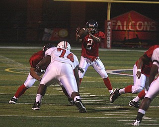 FITCH - Quarterback (2) Demitrious Davis grabs the snap during their game Friday night in Austintown. - Special to The Vindicator/Nick Mays