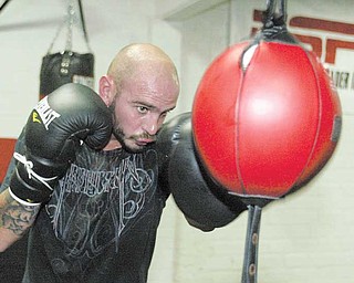 Kelly Pavlik trains on the double-end bag on Wednesday at the Southside Boxing Club.