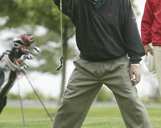 William d LEwis The VindicatorJerry Bollinger lines up a putt during Friday action in Senior devision.