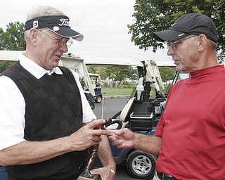 William D. Lewis the Vindicator Senior winner Bob Leonard , left, talks with runner up Kurt Beler after winning a 4 hole sudden death playoff.