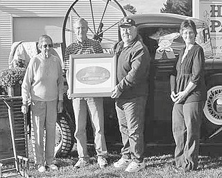 ‘Junk in the Trunk’ sale: The newly formed Winona Area Historical Society will sponsor its first fundraiser, a “Junk in the Trunk” sale from 9 a.m. to 3 p.m. Oct. 9, rain or shine, at Hall Park, Whinnery Road. Among those preparing for the event with a trunk load of goods above are, from left, Myrtle Bailey; Robert Brandt, vice president; Derek Coffee, president; and Sheila Jackson, secretary/treasurer. Interested vendors can request a registration form by contacting the WAHS at wahsohio@gmail.com or by calling 330-222-1136 or 330-332-9606. The $20 fee reserves a vending spot for cars, trucks or vans with sellers providing their own tables and chairs. Food and refreshments will be available.