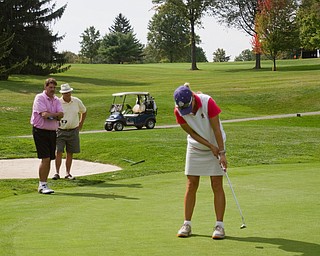 Geoffrey Hauschild|The Vindicator
George Allen, of Riverview Golf Course, Glenn Milton, of Mill Creek, and Alexandra Casi, of Avalon Lakes, play hole 17 at The Lake Club during the open division of the Greatest Golfer in the Valley tourney.