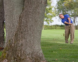 Geoffrey Hauschild|The Vindicator
Having a severe allergy to bee stings, Joshua Zarlenga, of Youngstown CC, is allowed to move his ball away from trees containing an active bee hive while on the 18th hole at The Lake Club during the open division of the Greatest Golfer in the Valley tourney.