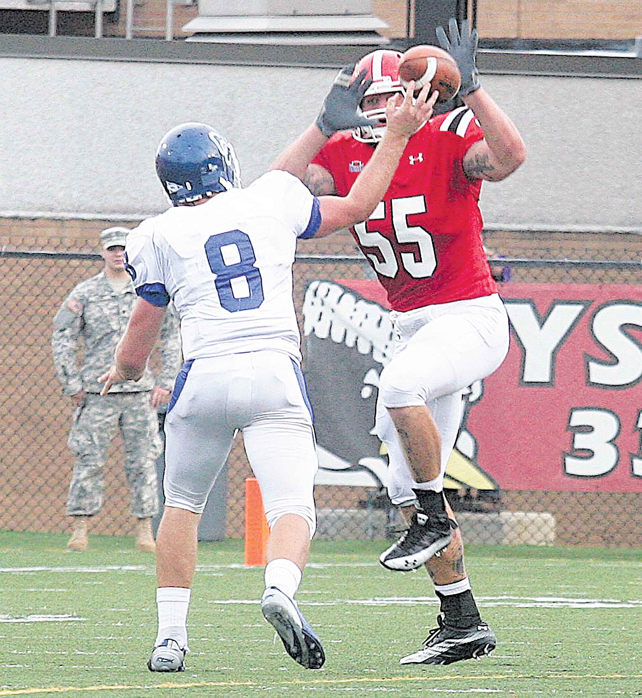 Gunnar Jespersen tries to avoid (55) Stephen Meadows Saturday evening.