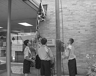 Patriotic pupils, a pledge and a prayer: Boy Scouts Christopher Perry, Jared Argiro, Patrick Brennan and John Brennan commemorate the beginning of the first day of school at Holy Family School in Poland. The Pledge of Allegiance and an opening prayer were said before students were led into the school by their teachers.