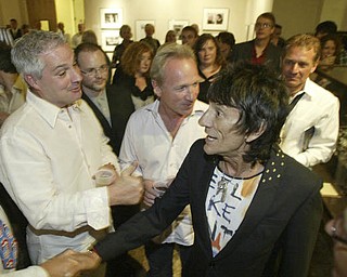 William D. Lewis The Vindicator Ronnie Wood shakes hands with visitors at the Butler Museum of American Art Sept. 21, 2010.