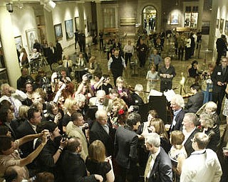 William D. Lewis The Vindicator Ronnie Wood shakes hands with visitors at the Butler Museum of American Art Sept. 21, 2010.