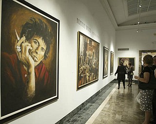 William D. Lewis The Vindicator Spectators look at Ronnie Wood art at the Butler Museum of American Art Sept. 21, 2010.
