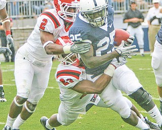ROBERT K. YOSAY | THE VINDICATOR..YSU #23 Nick Gooden Tackles #25 PSU Silas Redd with the help of YSU #2 Andre Elliott during third quarter action..YSU LOSES 44-14 PENN STATE at BEAVER STADIUM IN HAPPY VALLEY.-30