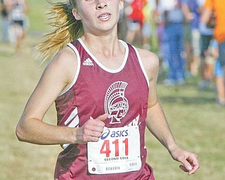 Boardman senior Katie Heney crosses the finish line of the Suburban League Championship cross country
meet at the Canfi eld Fairground on Tuesday. Heney took first place for the girls, who had 327 registered
runners. The event had more then 1,200 runners, including middle school boys and girls.