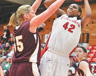 Youngstown State sophomore Brandi Brown takes a shot during a basketball game at the Beeghly Center. Brown is one of the key components in turning around the Penguins, who went 0-30 last season.