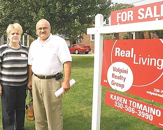 Karen and John Tomaino, real-estate agents with Real Living Volpini Realty Group, talk about safety precautions they and other agents use when showing homes. John Tomaino, a former law-enforcement officer, said he hopes the recent violent crimes against local agents encourage agencies to review their safety procedures.
