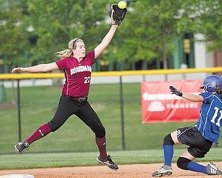 Boardman's Brooke Meenachan, reaches up and successfully makes the catch but not in time to keep Madison's Ashley Palmer from safely arriving at second base during the first inning of the 2010 Div. 1 Regional Semifinal game at the University of Akron's Lee R. Jackson Softball field.