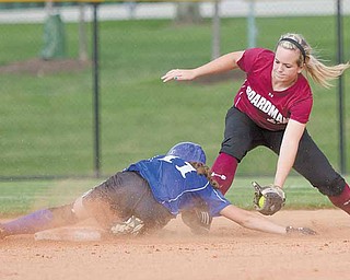 Boardman's Brooke Meenachan, successfully makes the catch but not in time to keep Madison's Ashley Palmer from safely arriving at second base during the first inning of the 2010 Div. 1 Regional Semifinal game at the University of Akron's Lee R. Jackson Softball field.