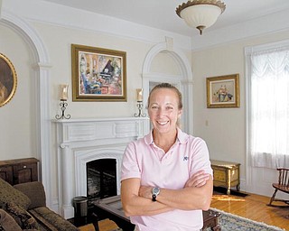 Becky Rudzik stands in her favorite room of her historic 1845 home. Rudzik, like many other homeowners in Poland, tries to maintain and preserve a historic home.