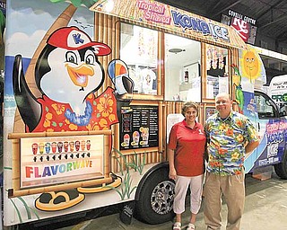 New business owners Renee and Tim Oswald show off their Kona Ice truck, which specializes in tropical shaved ice. The Oswalds joined more than a 100 other local businesses Thursday at the Youngstown/Warren Regional Chamber’s 2010 Business Showcase.