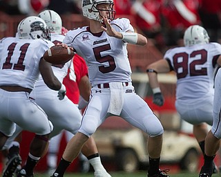Geoffrey Hauschild|The Vindicator.Southern Illinois' Chris Dieker (5) throws a pass during the first quarter of a game at Youngstown State University's Stambaugh Stadium on Saturday afternoon.