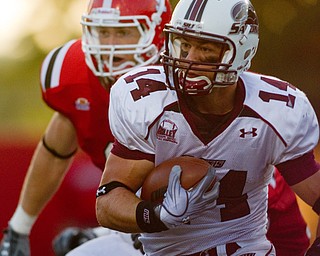 Geoffrey Hauschild|The Vindicator.Southern Illinois' Joe Allaria (14) runs downfield to score a final touchdown for the Salukis during the fourth quarter of a game at Youngstown State University's Stambaugh Stadium on Saturday afternoon.