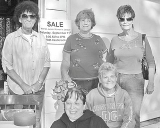 GFWC/Warren Junior Women’s League International Outreach Community Service and Conservation Community Service programs sponsored a garage sale in September. Proceeds from the event will provide much-needed food, shelter and educational materials for mothers and orphaned or abandoned children in war-torn countries. Among those reaching out to help the helpless through the “Mother’s Without Borders” program are, from left in back, Shelby McElravy, district chairman of International; Peggy Boyd, event chairwoman; and Dorie Harris, co-chairwoman; and in front, Barbara Denman and Lee Carter, Conservation.