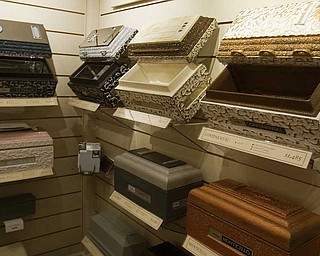Small samples of burial vaults line the walls at the Kinnick Funeral Home on Meridian Road in Youngstown. The home has been in operation since 1973.