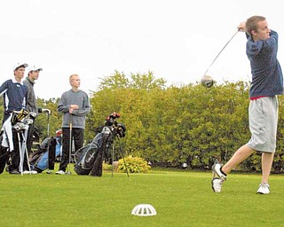 McDonald golfer Brandon Pustay tees off during practice at Mahoning Country Club. The Blue Devils fi nished in third place in the Inter Tri-County League this season.