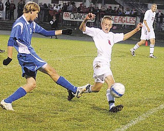 Daniel Rumsey of Salem, center, attempts to block a shot by Connor Syersal of Hubbard during a soccer game Tuesday. Salem won 3-0.