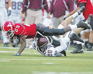 YSU WR Dominique Barnes (29) is tackled by Missouri State’s Mat Hottleman (20) in last year’s game at Stambaugh Stadium. Barnes and the Penguins are hoping to snap a two-game losing skid to the Bears.
