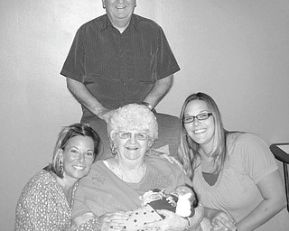 Generation of excitement: The birth of Isabella Slifka was cause for celebration as her family gathered to commemorate five generations. Isabella, born to Joe and Deanna (Brown) Slifka of Liberty on Sept. 3, was only nine days old when she met her great-great-grandmother, Bertha Pirlozzi, 91, of New Castle. Isabella’s great-grandfather, Philip Pirlozzi of Masury, and her grandmother Felicia (Pirlozzi) Brown of Hubbard represent part of the five generations. Above, great-grandfather Philip beams as he stands over, from left to right, grandmother Felicia, great-great grandmother Bertha, holding Isabella, and Isabella’s mother, Deanna.