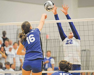 Lakeview’s Marissa Naples (16) and Hubbard’s Haley Turner (22) battle for the ball at the net during an All-American Conference White Tier contest Thursday at Hubbard. The Bulldogs defeated the Eagles three games to none to maintain a perfect record.
